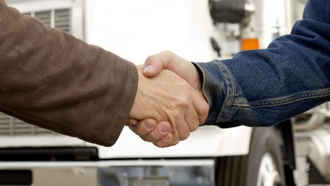 handshake_in_front_of_truck-648x366-2